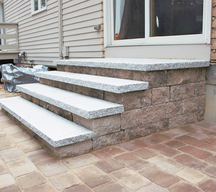 Woodbury Gray granite treads and concrete wall blocks 