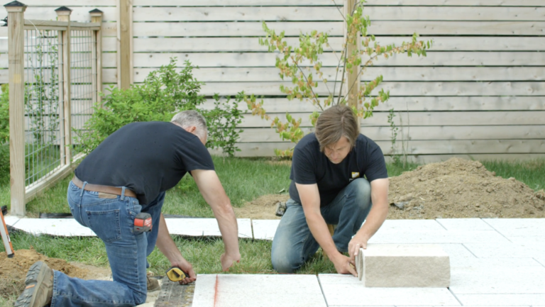 How to Build a Natural Stone Pillar Onto a Patio Wall