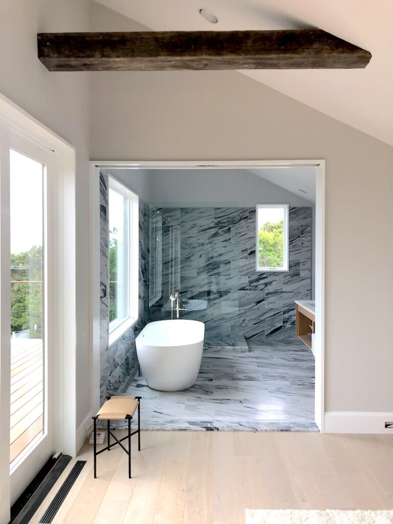Georgia Marble White Cherokee honed tiles and shower curbs in master bathroom — Studio Zung Atelier 211